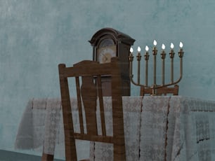 a table with a white table cloth and a wooden chair with a lit menora