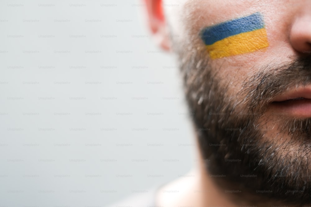 a man with a flag painted on his face