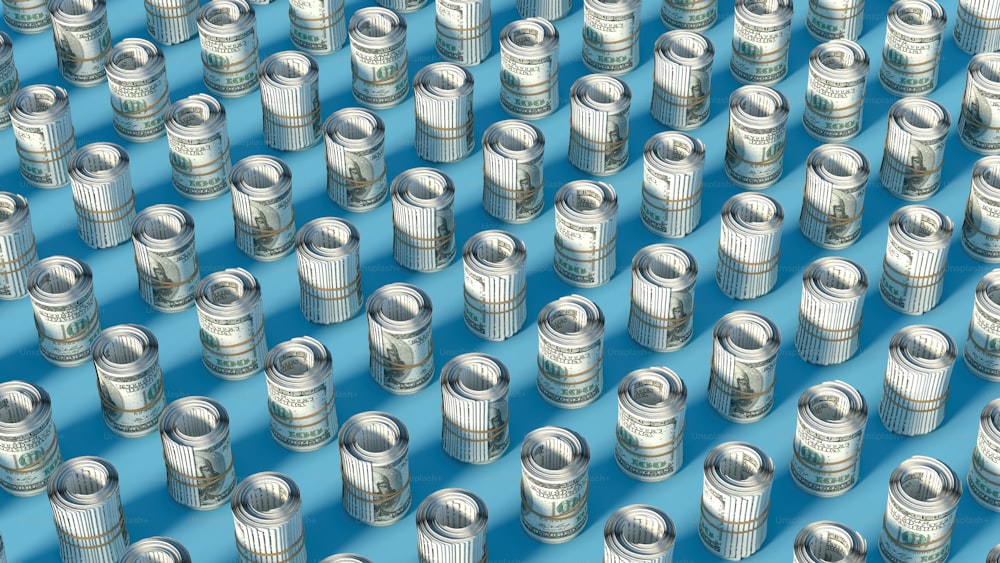 a large group of tin cans sitting on top of a blue surface
