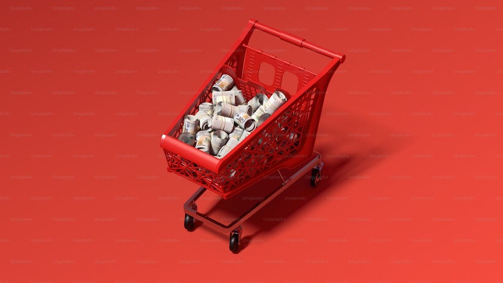 a red shopping cart filled with lots of money
