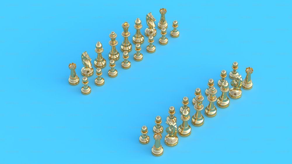 a group of gold chess pieces on a blue background