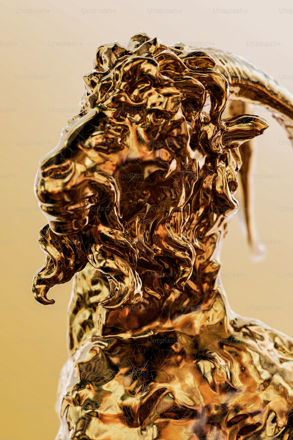 a golden statue of a goat with long horns