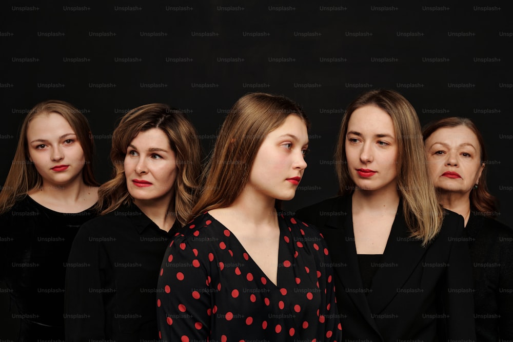 a group of women standing next to each other