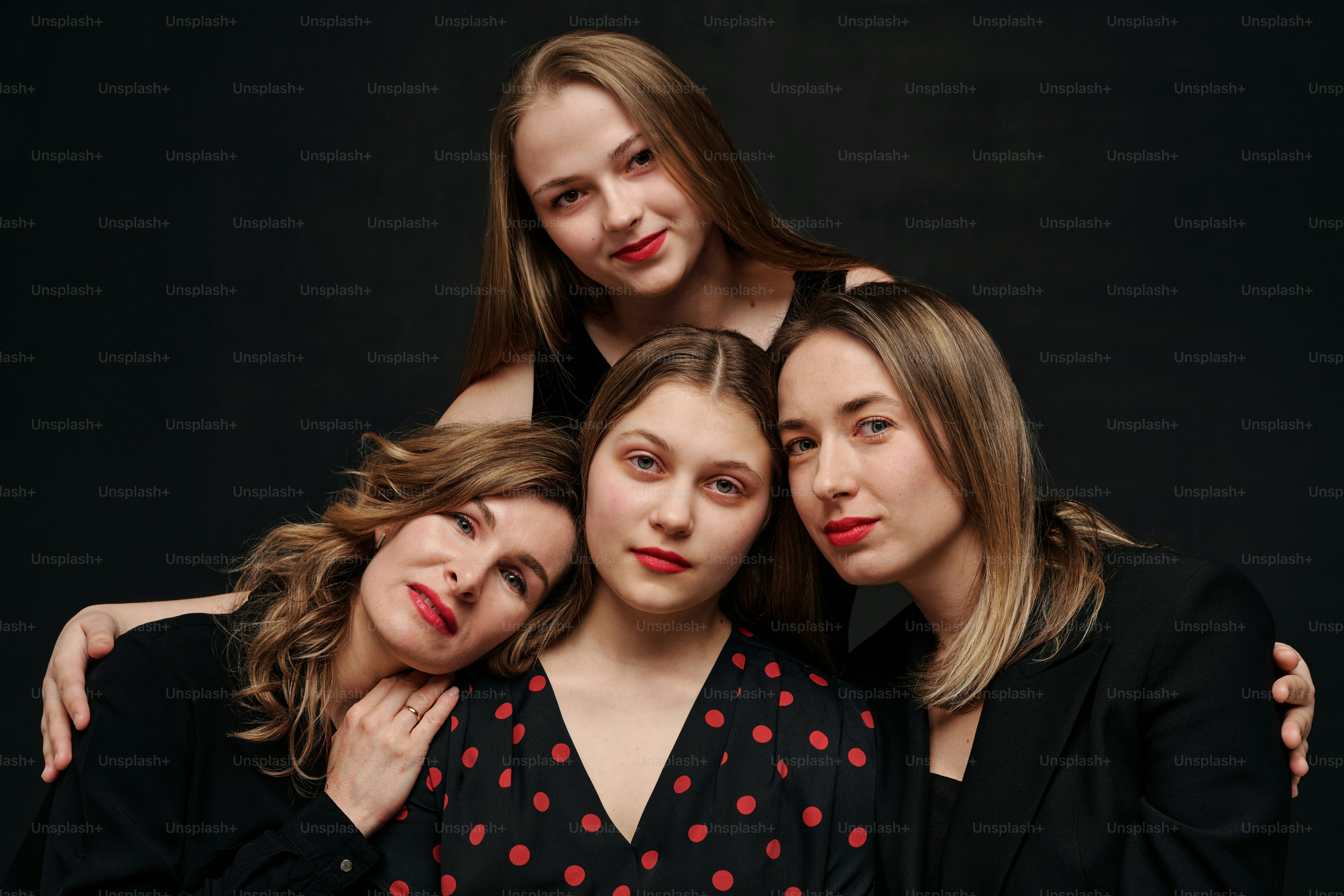 Studio portrait of a group of women of different ages and body types