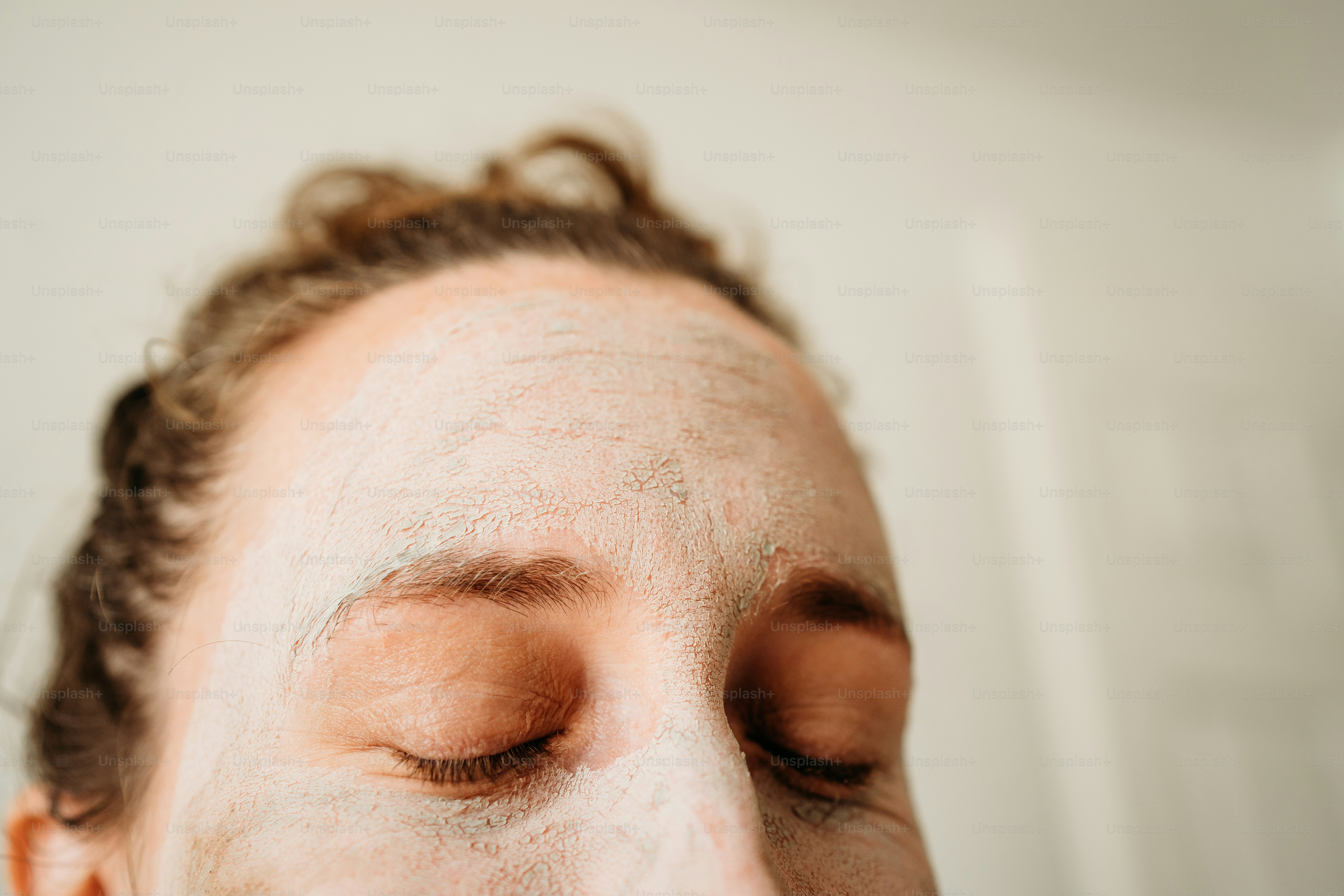 a close up of a person with a towel on their head