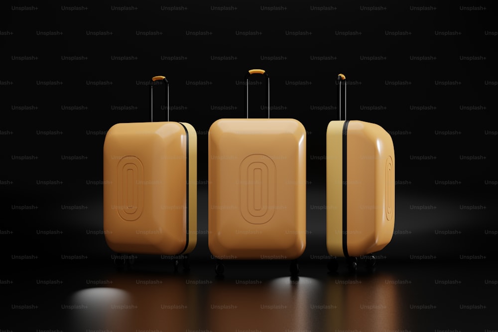 three pieces of yellow luggage on a black background