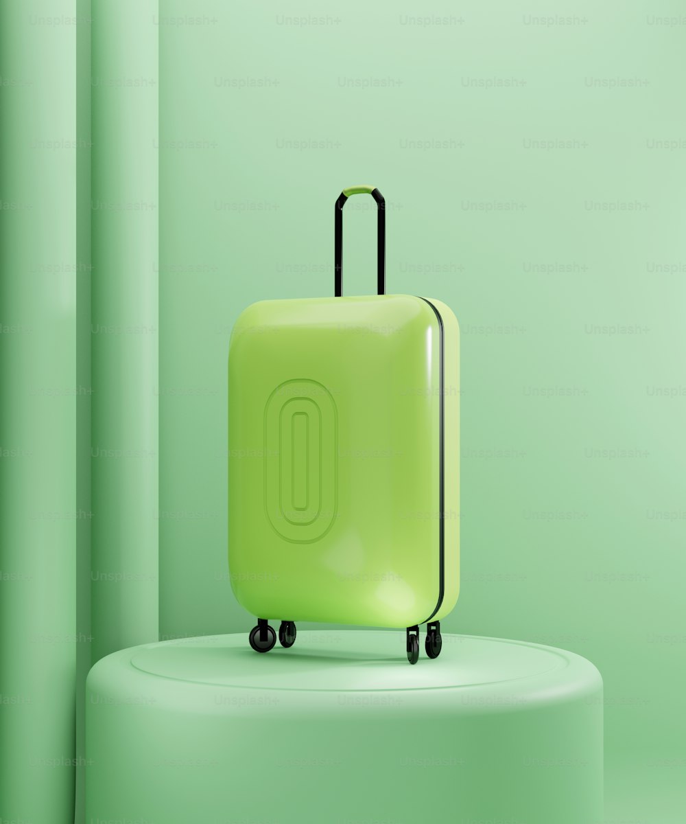 a green suitcase sitting on top of a white pedestal