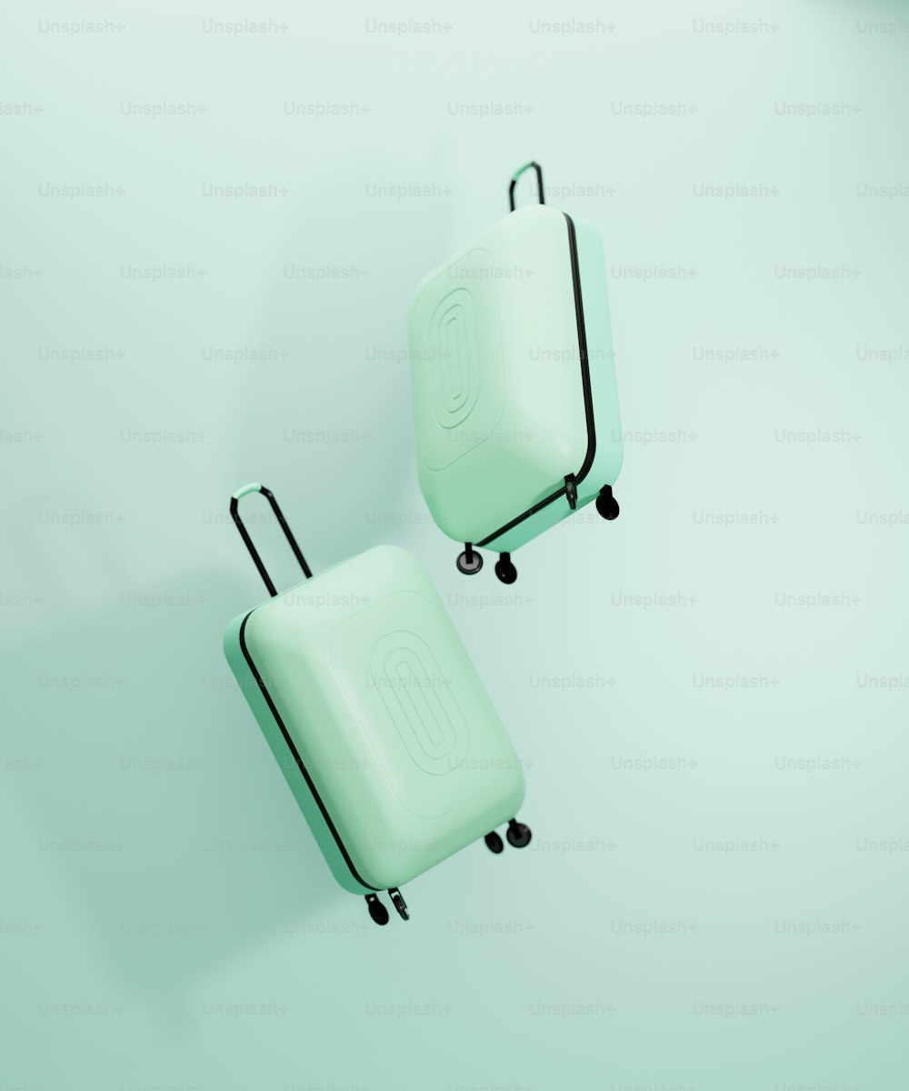 two green suitcases sitting on top of each other