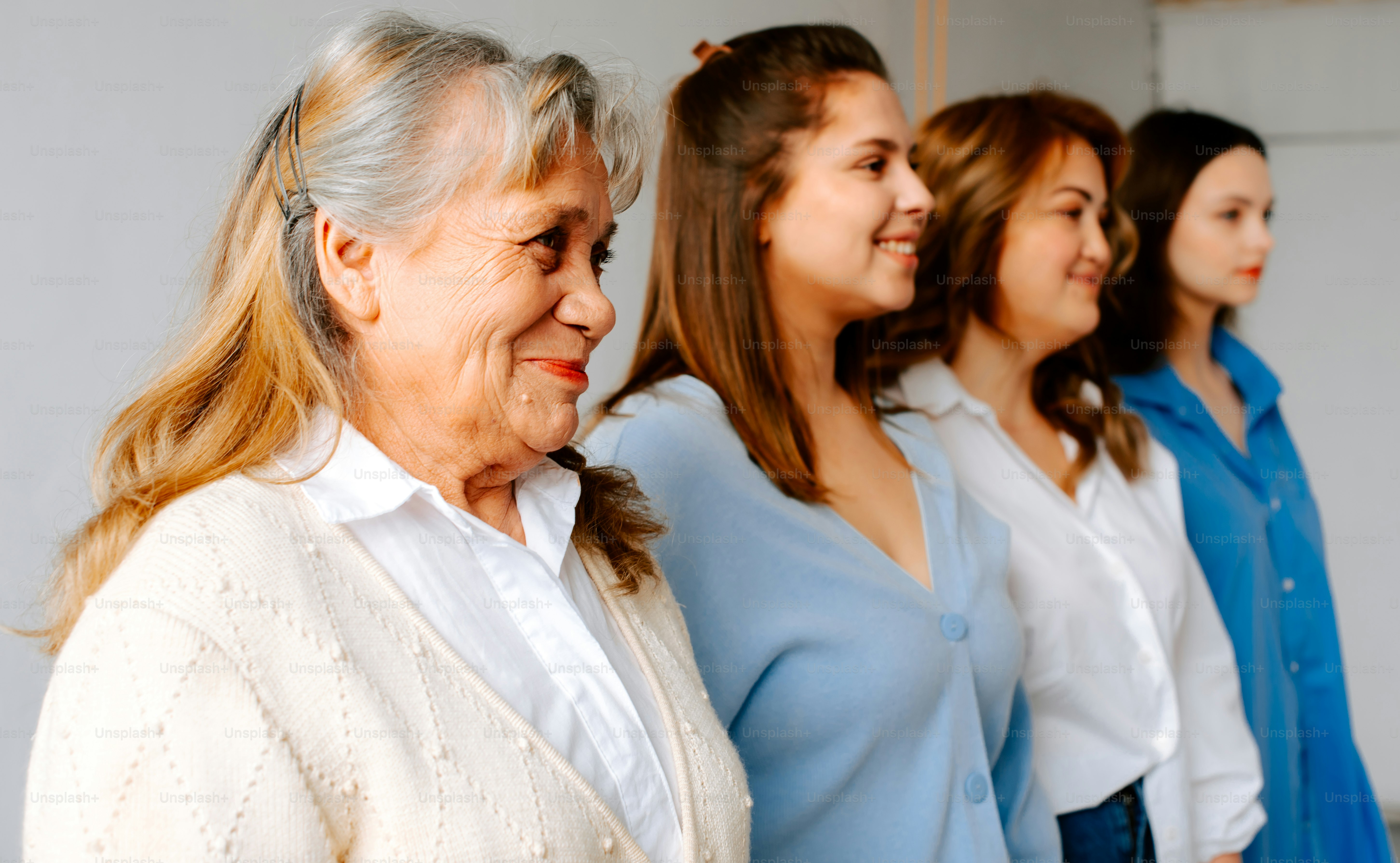 a group of women standing next to each other