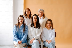 a group of women sitting next to each other