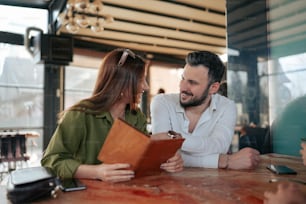 a man and a woman sitting at a table