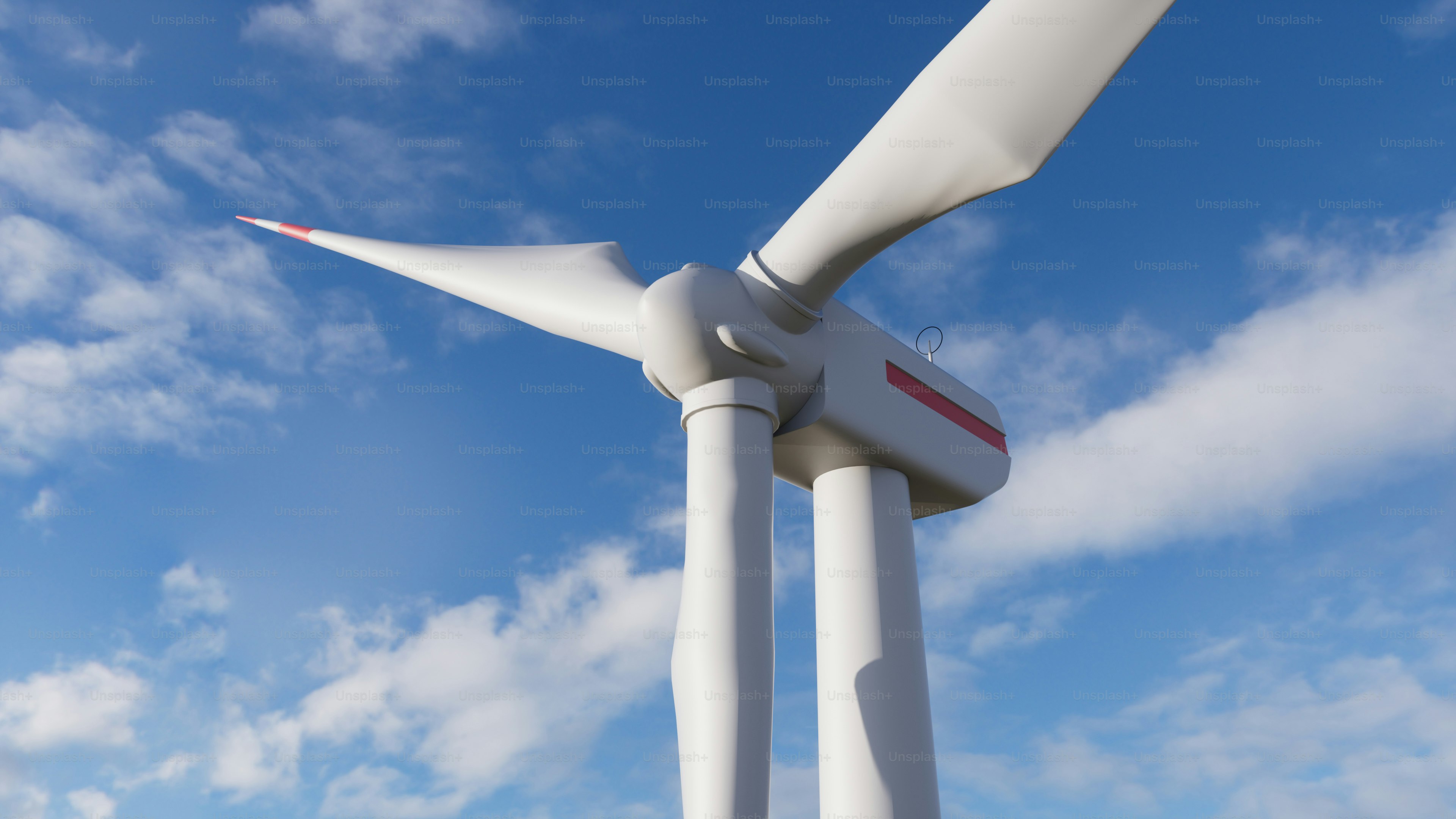a large white wind turbine on a sunny day