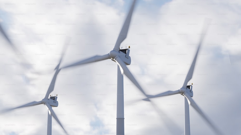 a group of wind turbines on a cloudy day