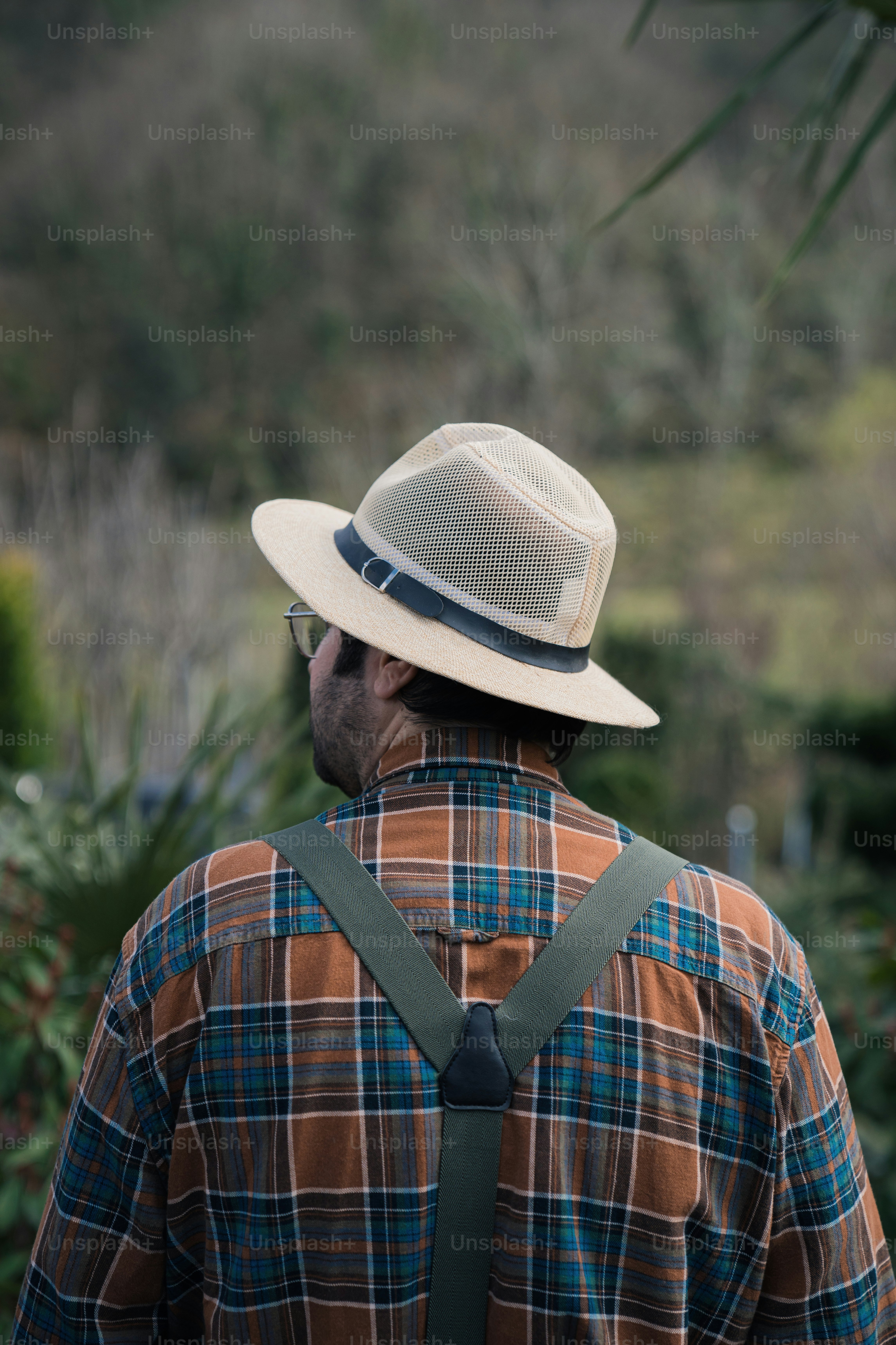 a man wearing a hat and a backpack