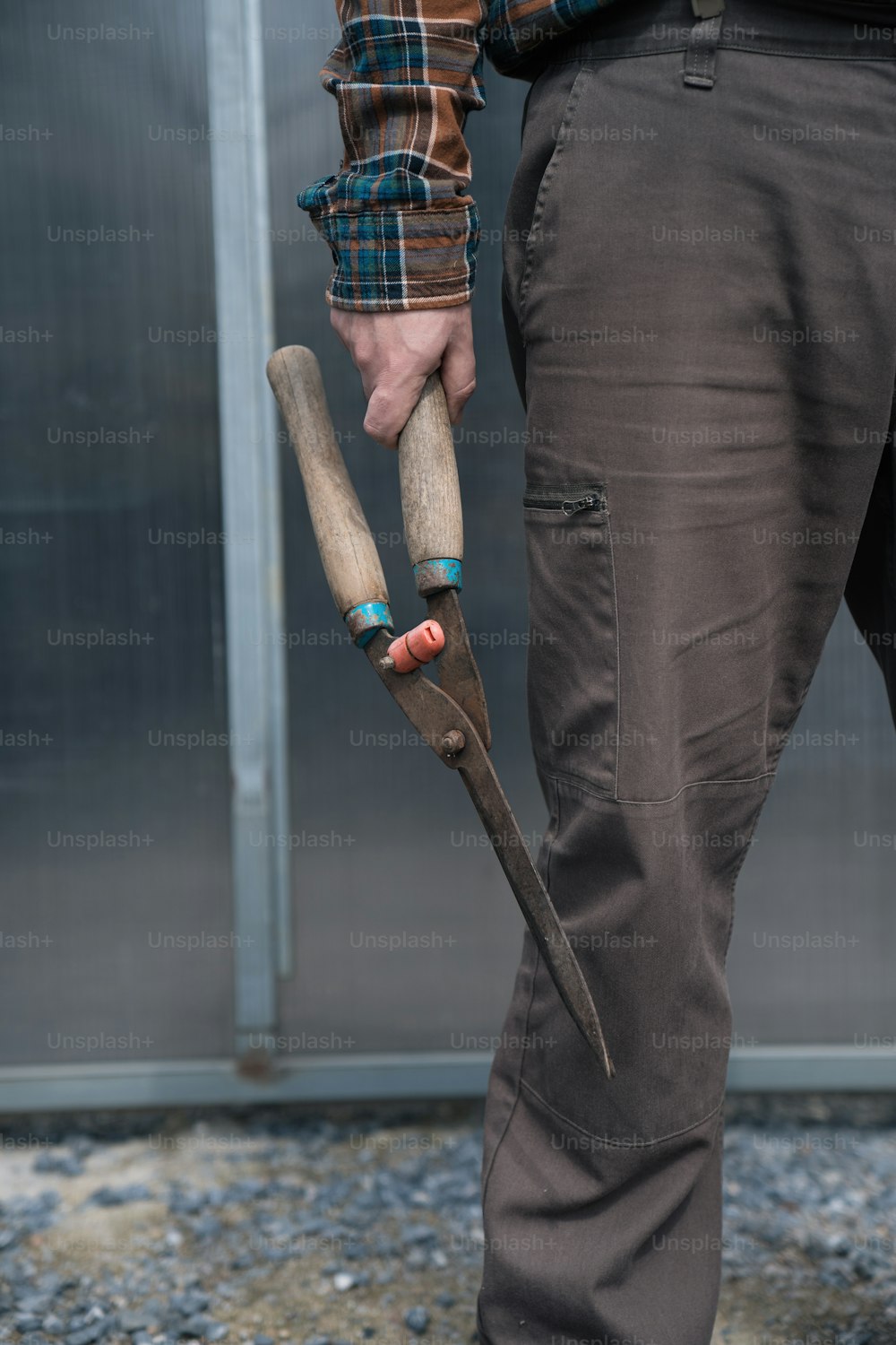 a man holding a pair of scissors in his hands