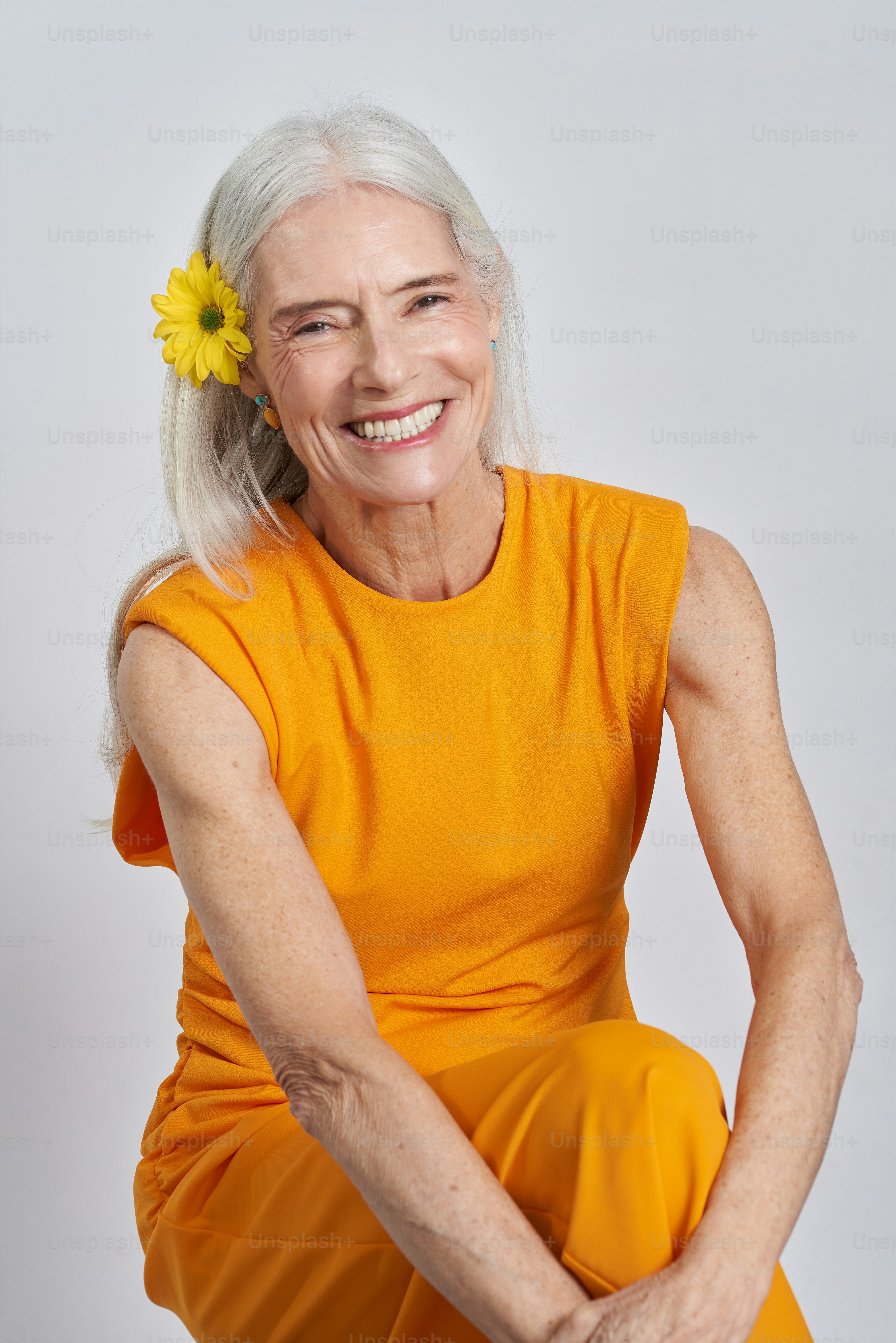 a woman with a flower in her hair