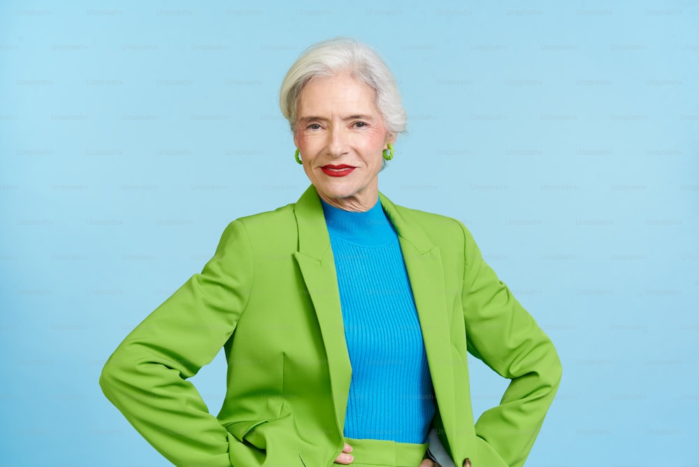 a woman in a green jacket and blue shirt