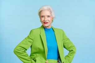 a woman in a green jacket and blue shirt