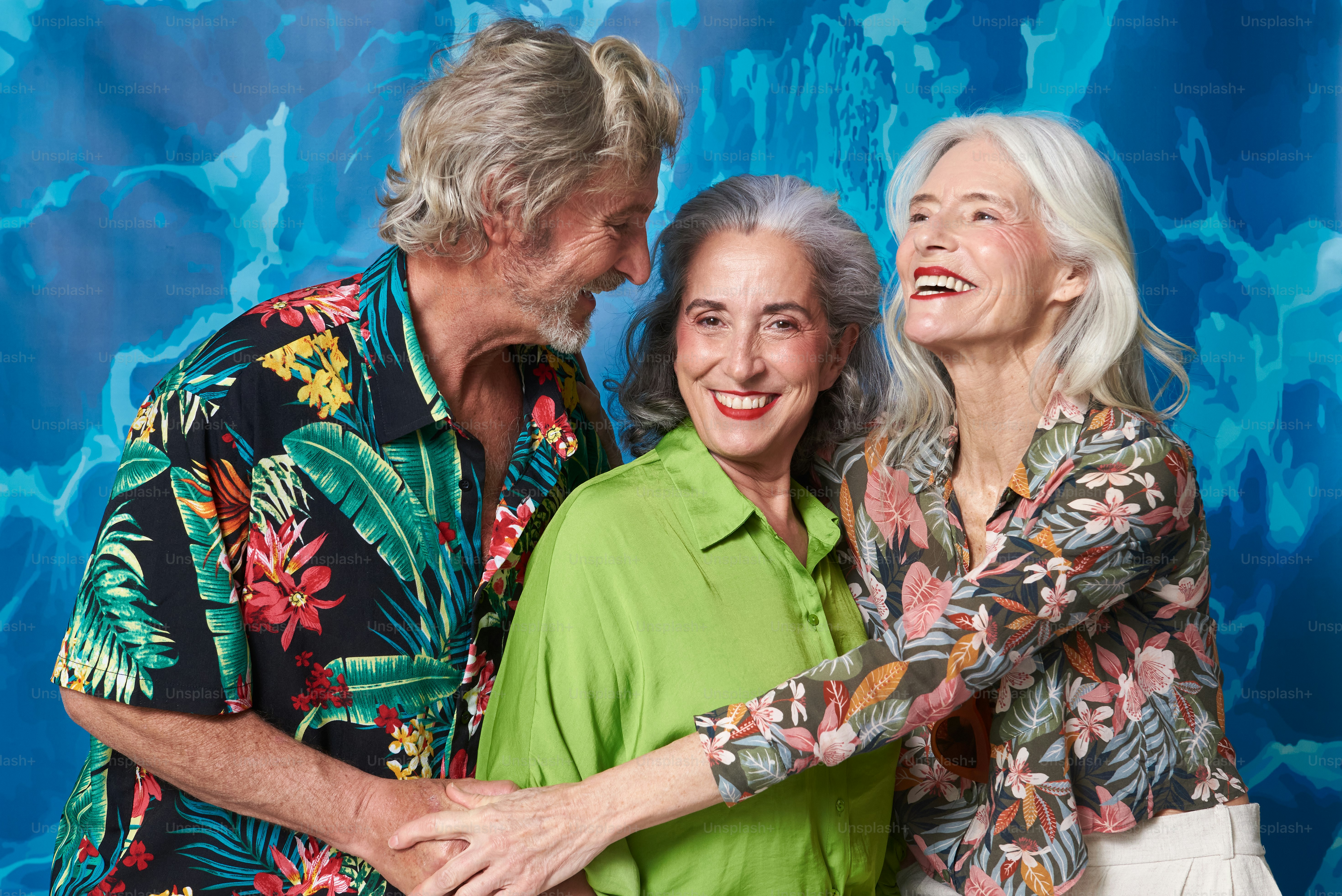 a couple of older people standing next to each other