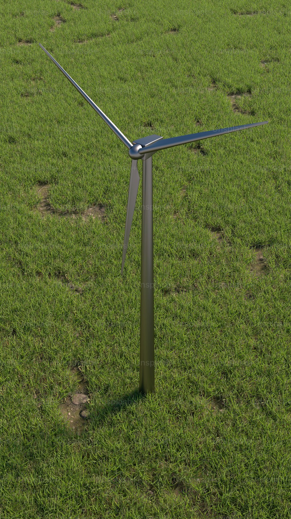a wind turbine in a field of green grass