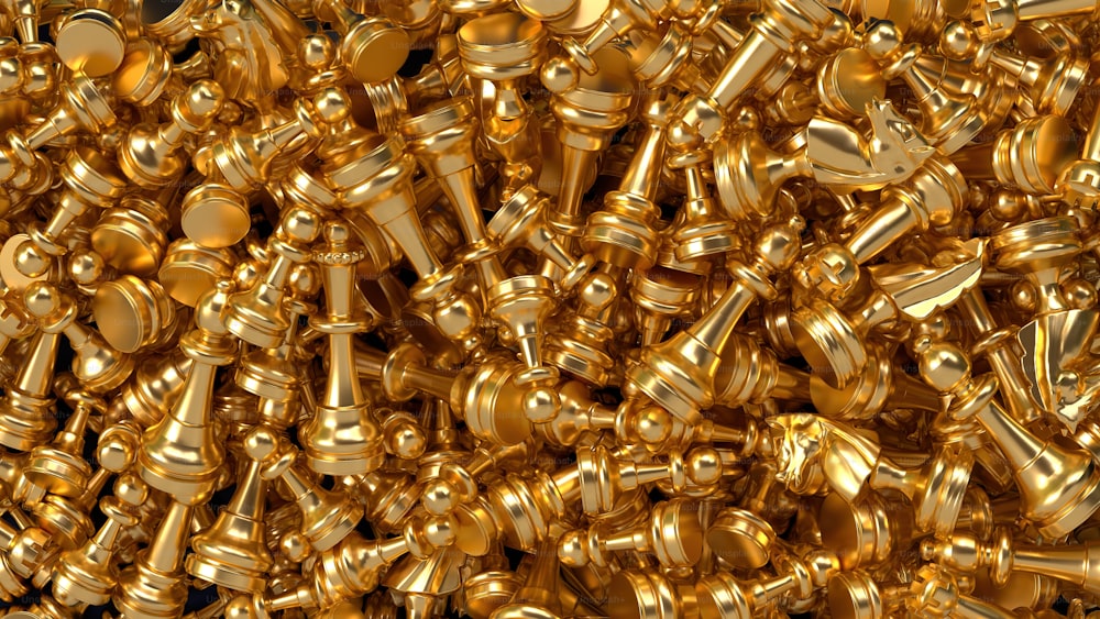 a large pile of gold colored metal objects