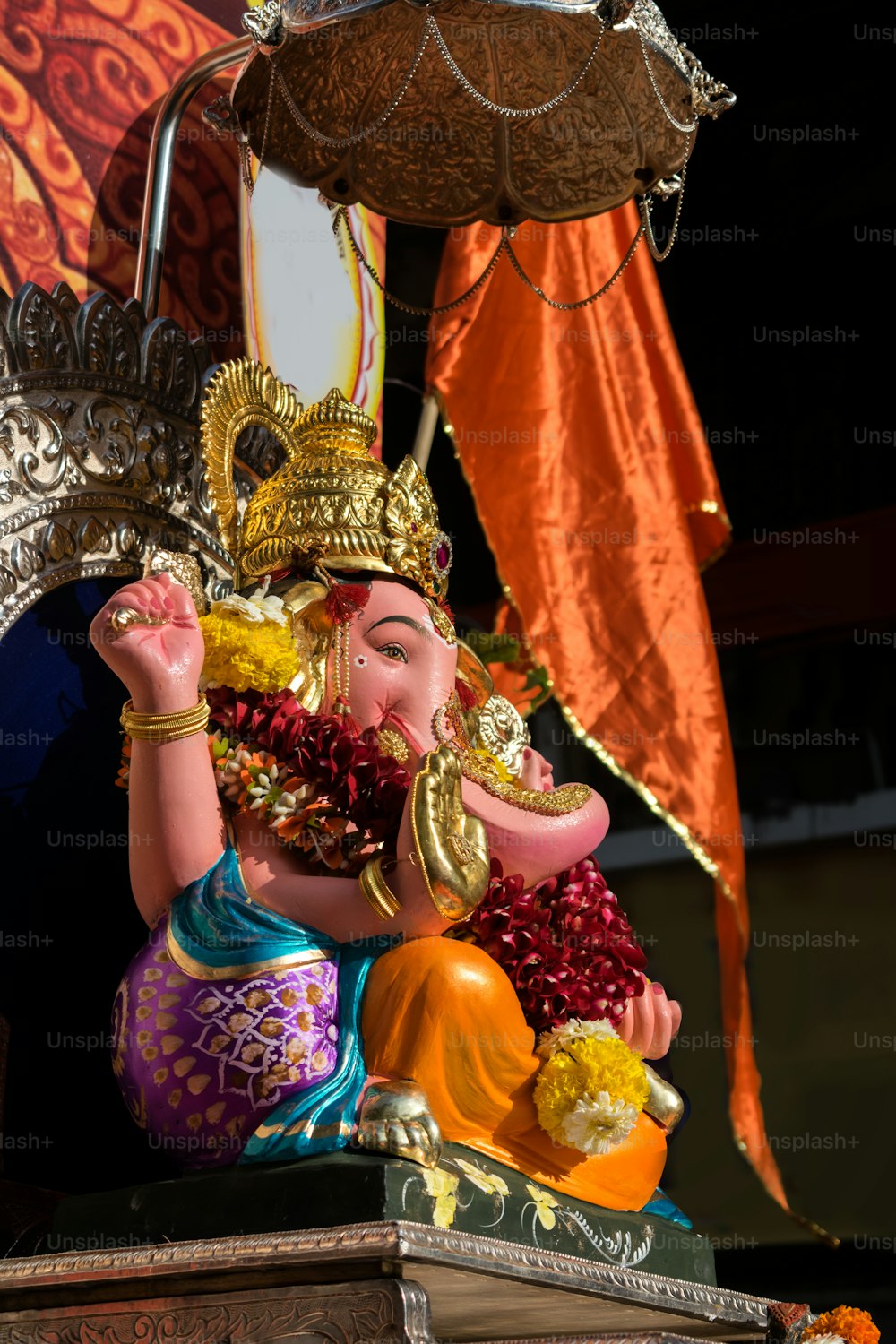 a statue of an elephant with a crown on it's head