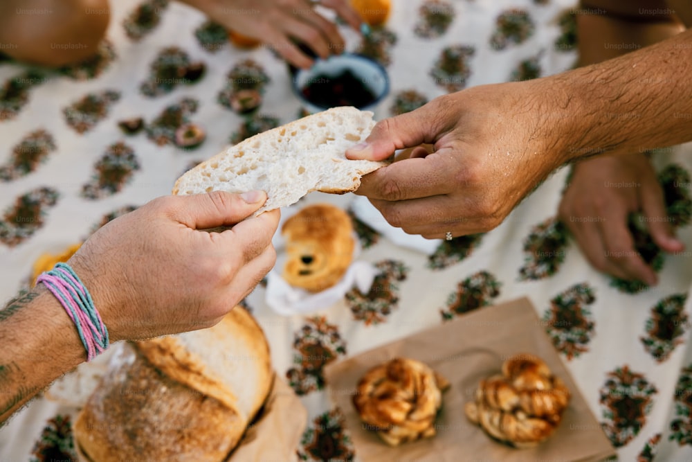 a group of people sitting around a table eating food