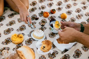 a man and a woman sitting at a table with food on it