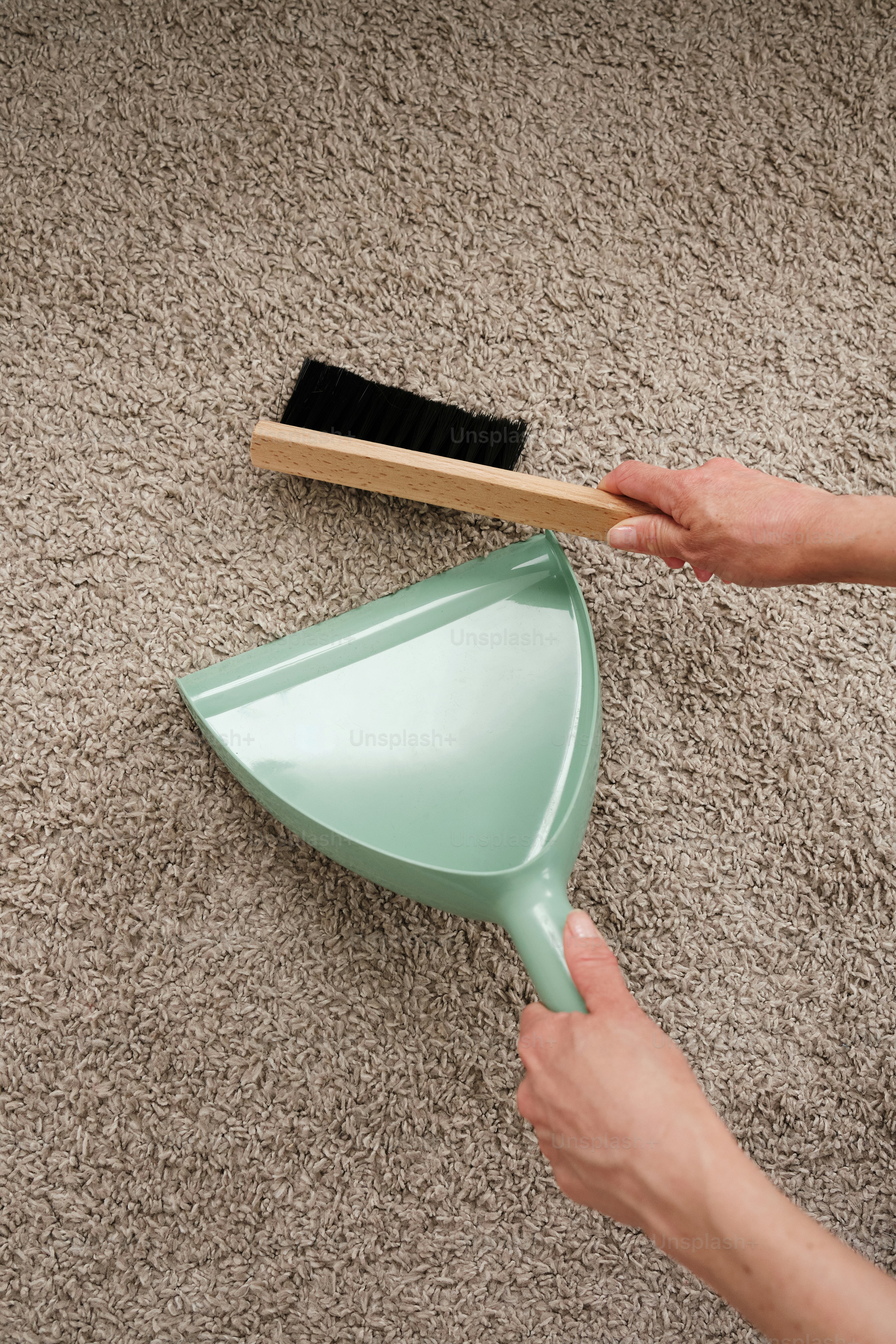 woman cleaning the carpet