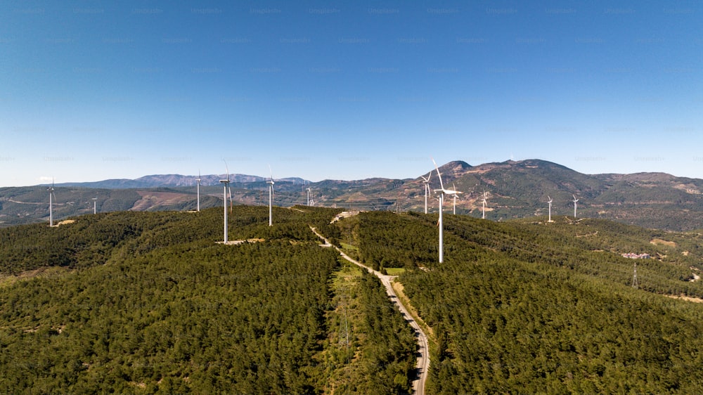 an aerial view of a wind farm in the mountains