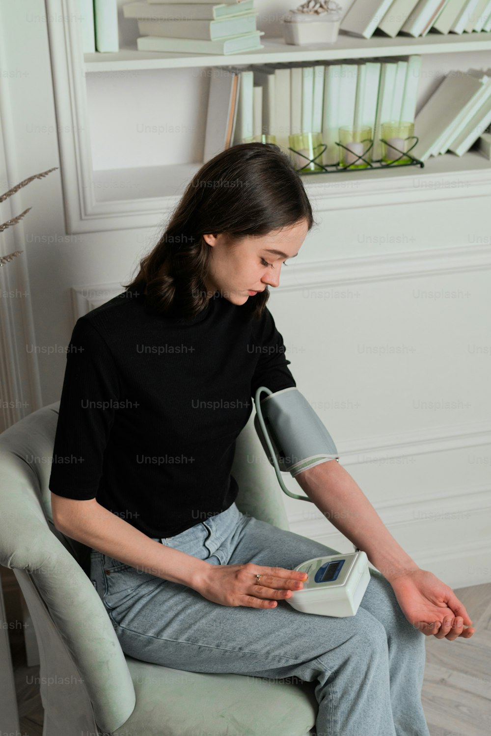 a woman sitting in a chair holding a book