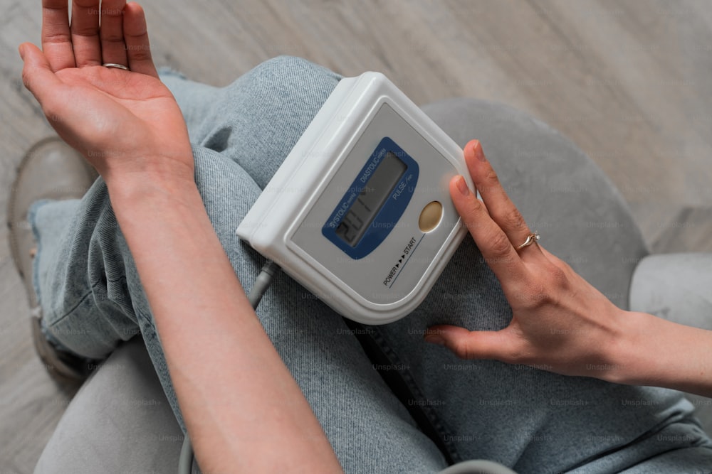 a person holding a digital scale in their hand