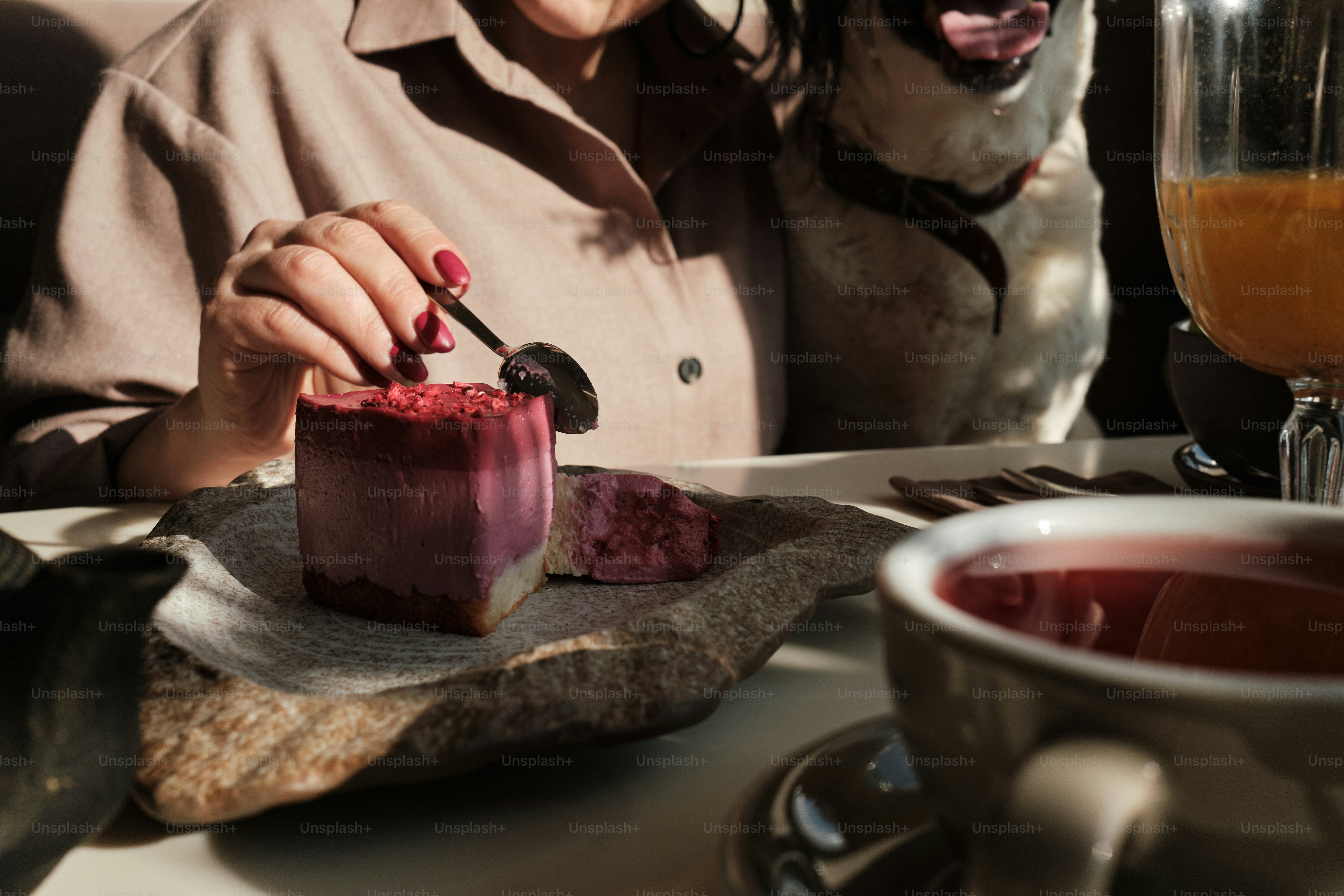 a woman sitting at a table with a plate of food