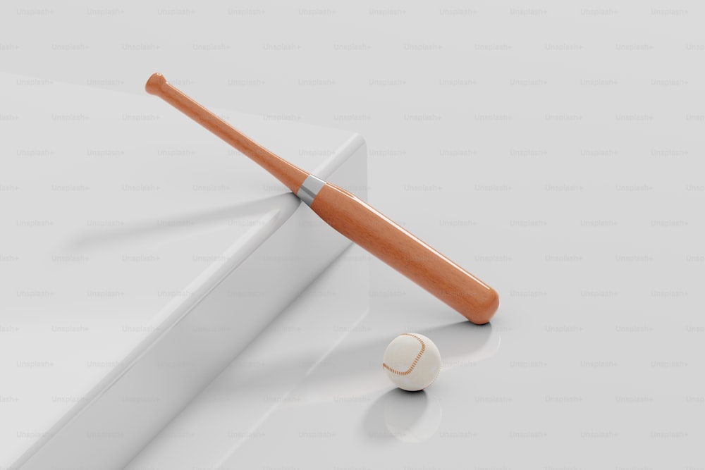 a baseball bat and a ball on a white surface