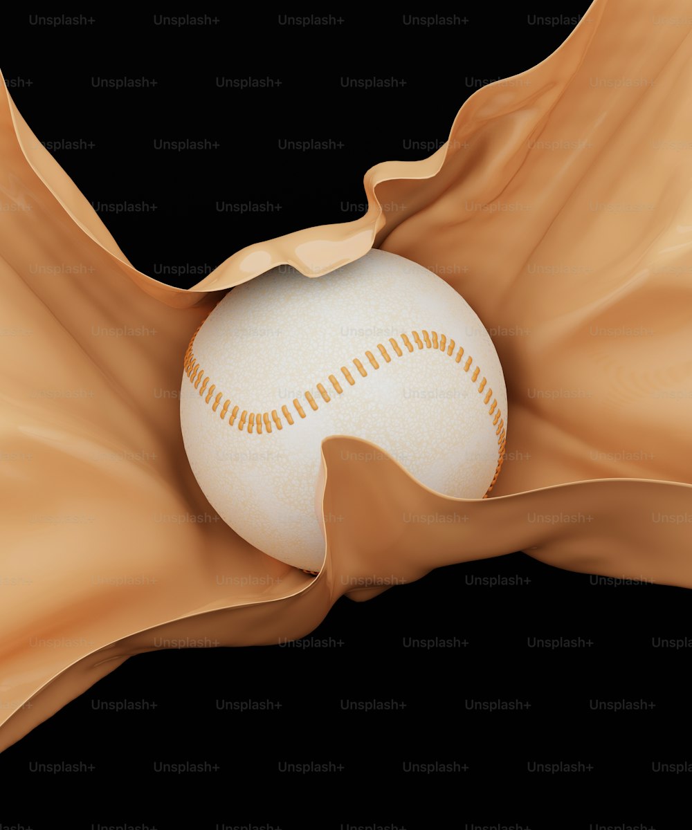 a white baseball in the middle of a brown fabric