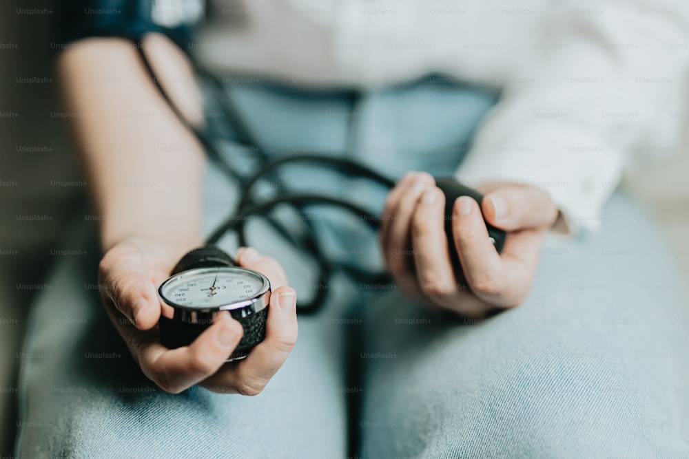 a person holding a clock and a stethoscope