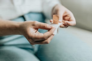 a person holding a small piece of paper in their hands