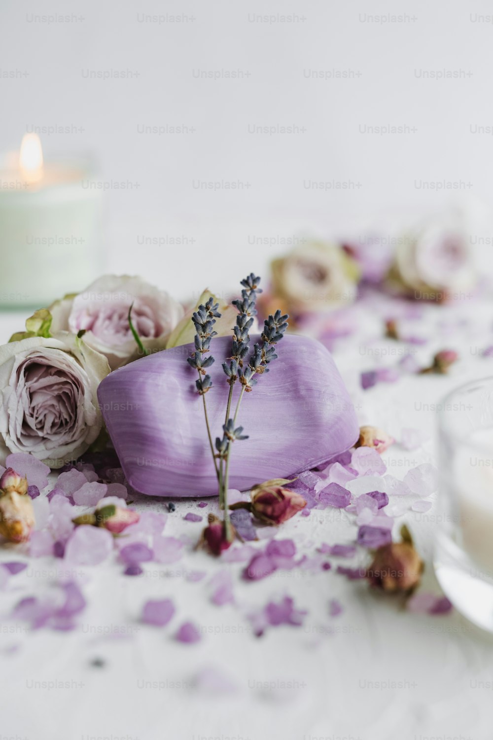 a candle and some flowers on a table