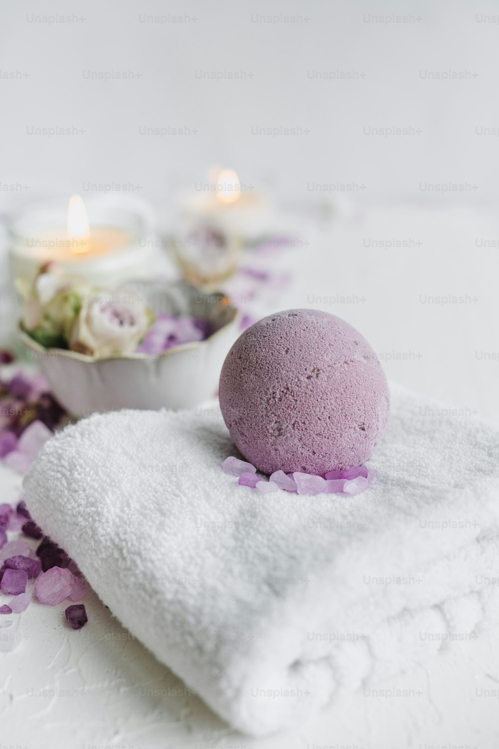 a bath ball sitting on top of a white towel