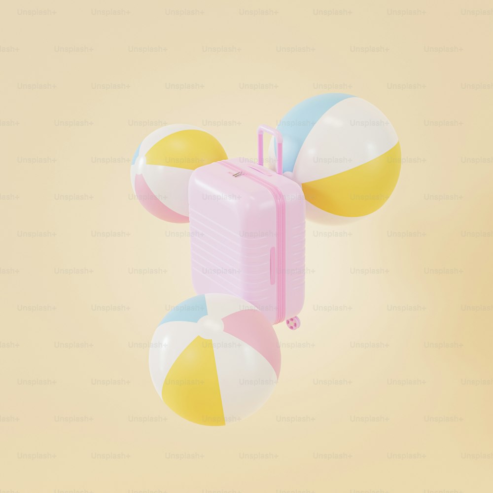 a pink suitcase and two beach balls on a yellow background