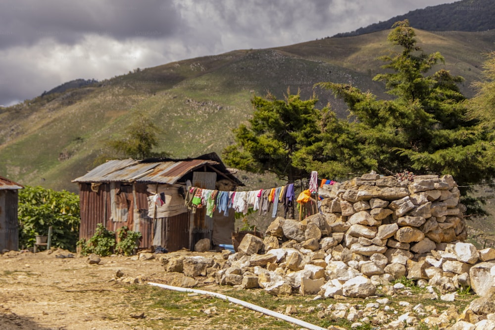 clothes hanging on a clothes line in front of a mountain