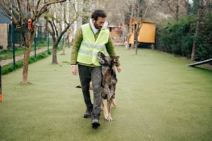 a man walking with a dog on a leash