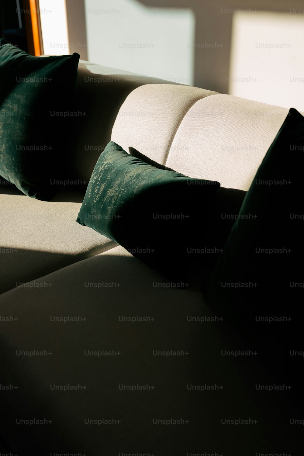 a close up of a couch with pillows on it