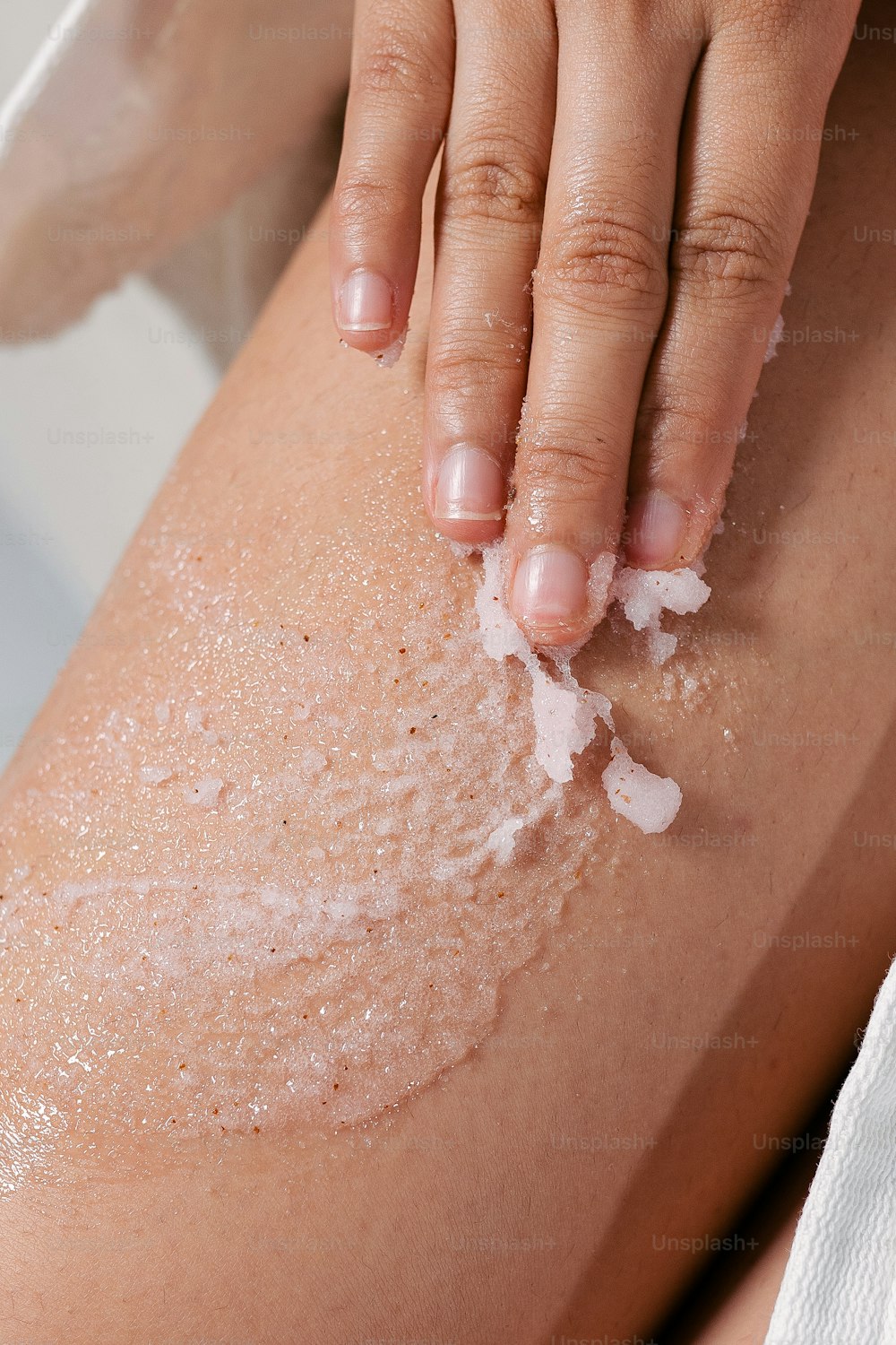 a close up of a person's legs with a lot of white stuff on