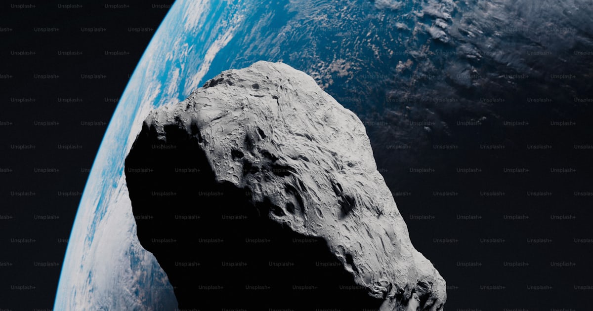 A large rock sitting on top of a blue planet photo – Meteorite Image on ...