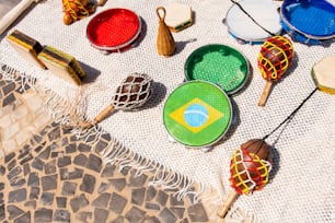 a table topped with lots of different types of tennis racquets