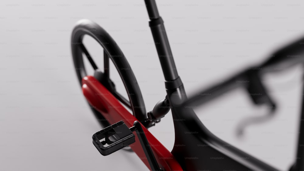 a close up of a bike with a red seat