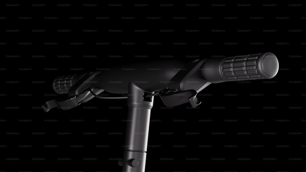 a close up of a bike handlebar with a black background