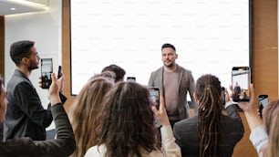 a man standing in front of a group of people