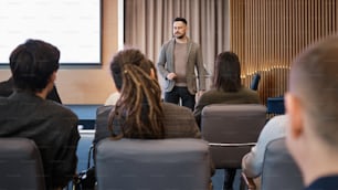 a man standing in front of a group of people